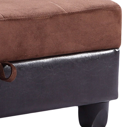 Close-up of the corner of a brown cushion atop the Stylish Storage Contemporary Ottoman, featuring black faux leather upholstery, short black legs, and a small fabric loop on the left side.