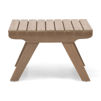 The Sedona Outdoor Side Table features an open slat rectangular top and four angled legs in a light brown finish. Its simple, modern design is showcased on a white background.