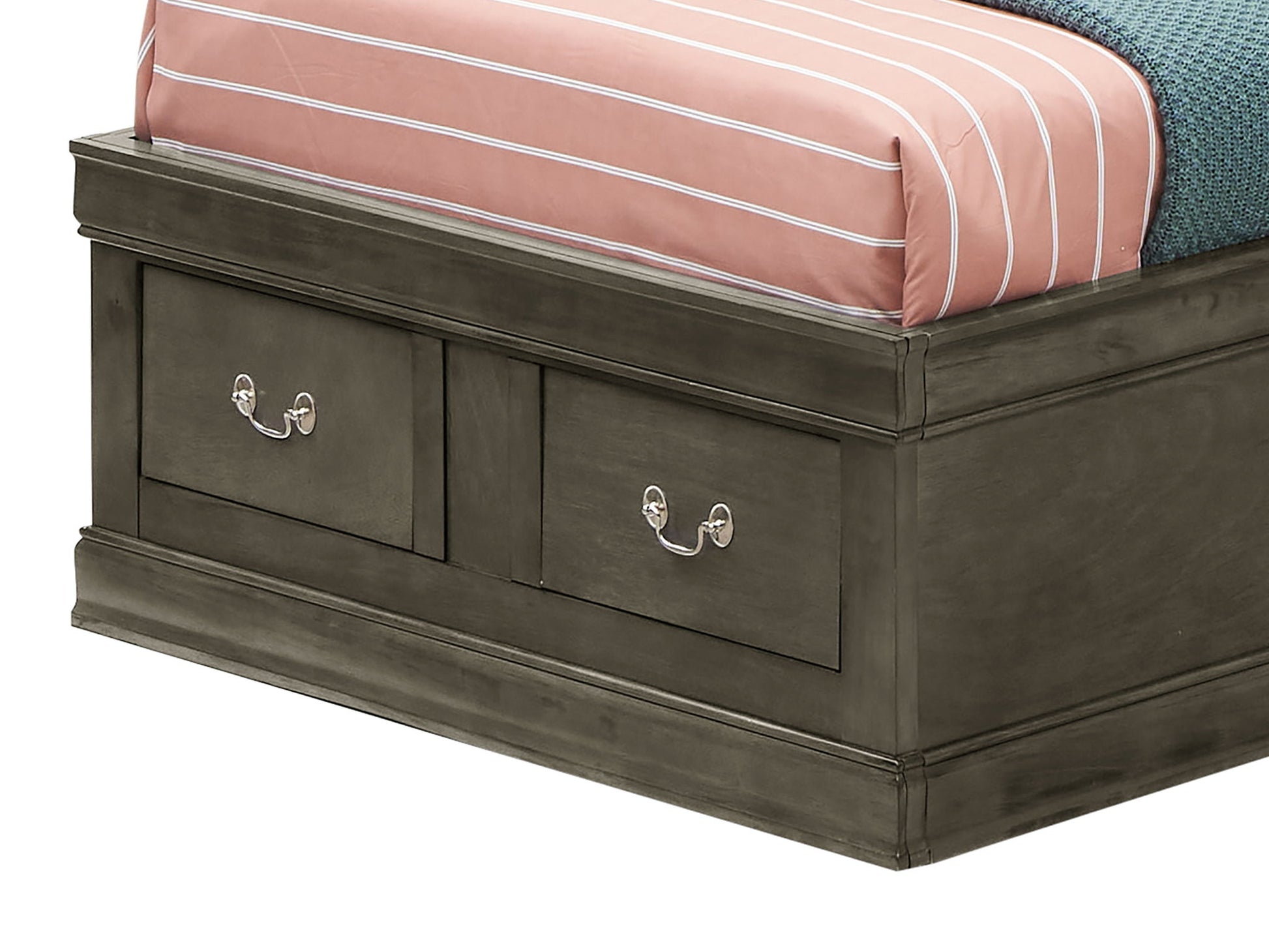 The image shows the lower corner of the Louis Phillipe Bookcase Storage Bed, featuring a dark wooden frame with two built-in drawers with metal handles at the base, topped with a mattress covered in a pink and white striped sheet.