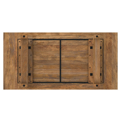 The Whitley Dining Table in Burnt Wax Brown is shown from above, upside down with its four legs folded inward, highlighting the tabletop's wood grain and black metal support bars on the underside.