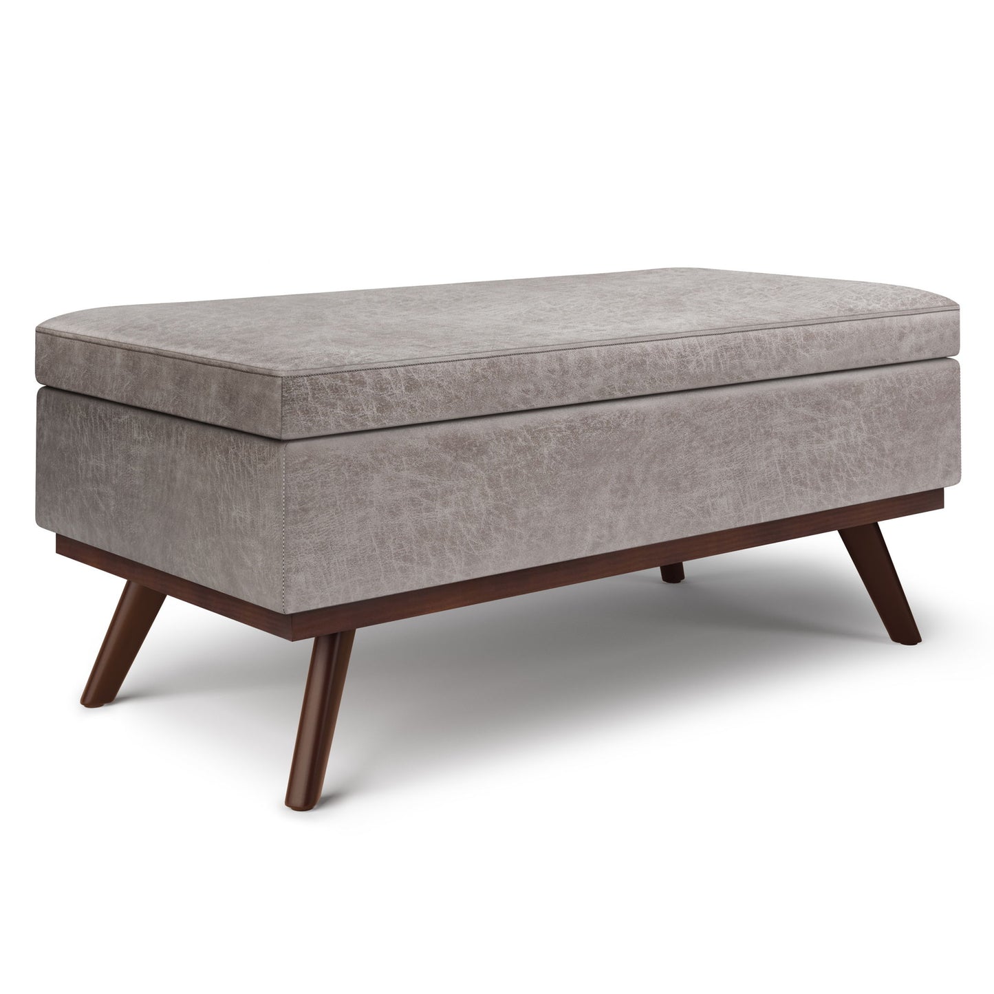 The Owen Lift Top Large Coffee Table Storage Ottoman features a rectangular, gray upholstered design with angled wooden legs and a cushioned top, shown against a white background in mid-century style.