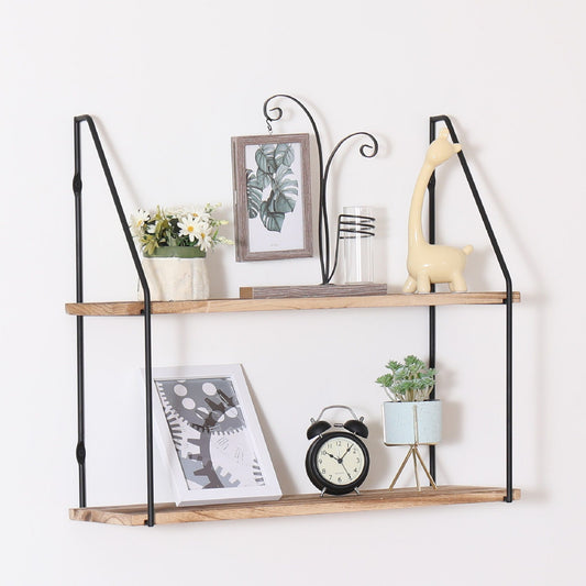 The Gardenia - Wall Mounted Wall Storage, Decorative Hanging Display features black metal supports and a wooden shelf to showcase items like framed prints, ceramics, clocks, plants, and art.