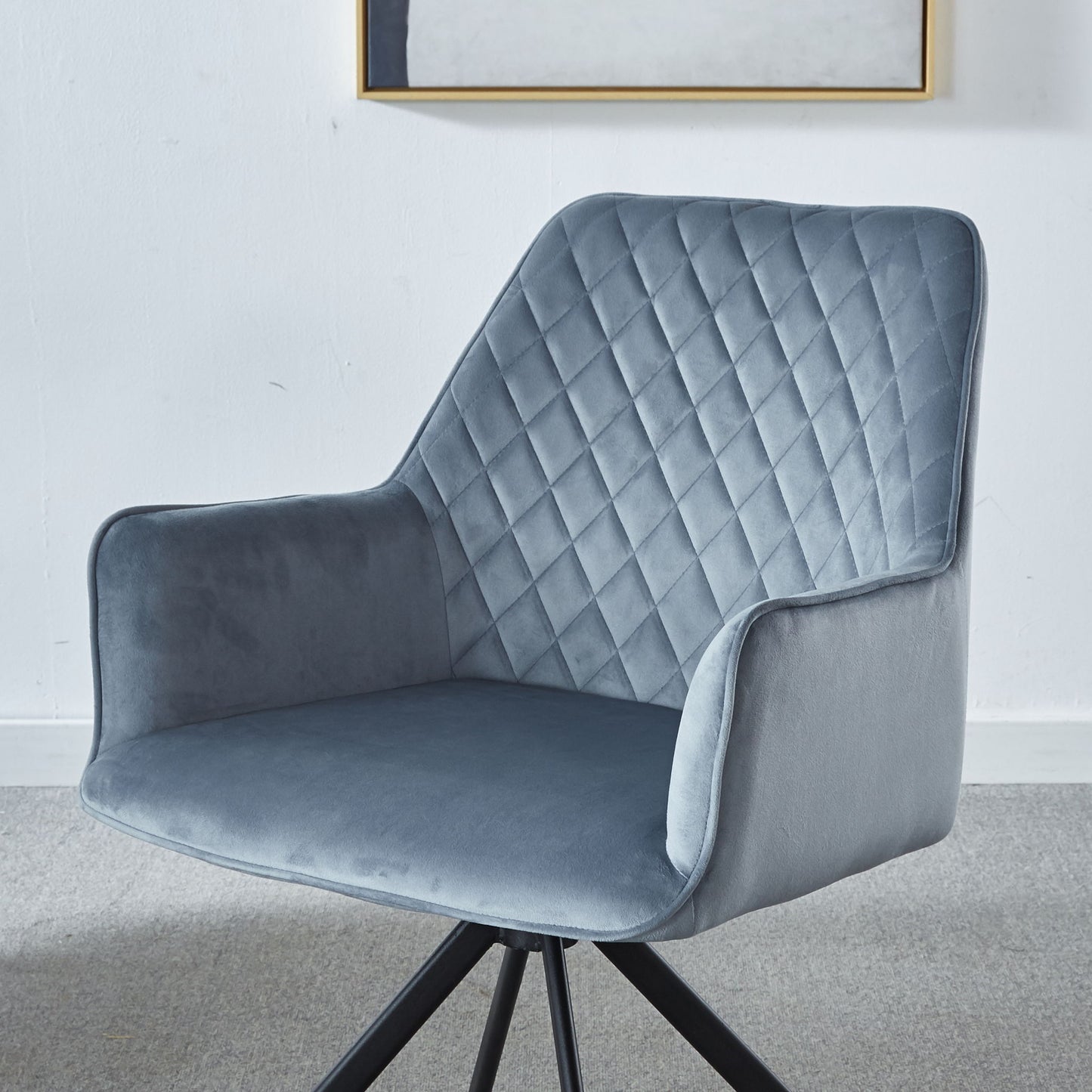 A Modern Desk Chair No Wheel, Ergonomic Office Chair with blue upholstery and metal legs sits in a light-colored room with minimalist walls and carpet, adding a stylish touch to your bedroom, reception area, or living room.