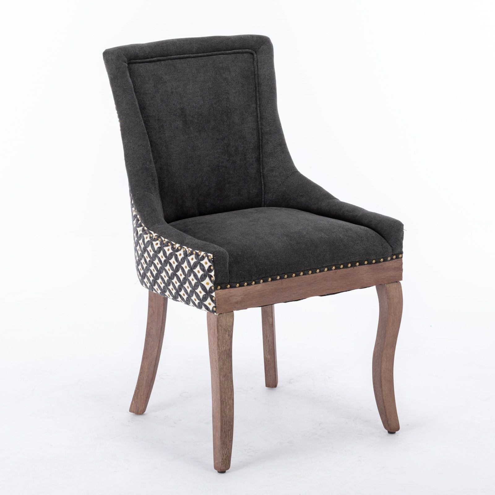 The Ultra Side Dining Chair set features thickened fabric in dark gray, neutrally toned solid wood legs, patterned side panels, and bronze nail head trim along the front edge, shown against a white background.