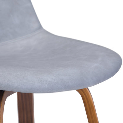 Close-up of the Randolph Bentwood Counter / Bar Height Stool (Set of 2) featuring a light grey, smooth upholstered seat and angled wooden legs.