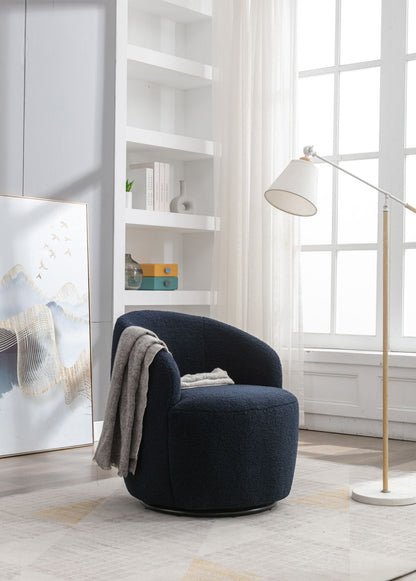 A Teddy Fabric Swivel Accent Armchair Barrel Chair with a gray throw sits by a tall white floor lamp and large window. Minimalist bookshelves and framed abstract artwork add style to the sunlit room.