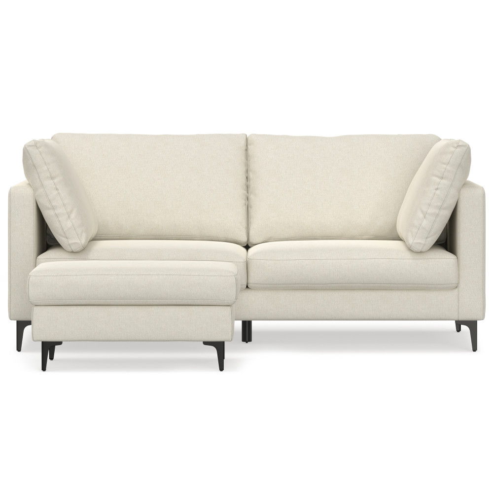 The Ava - Mid Century Sofa With Ottoman Set is a modern, light beige sectional with clean lines, two seat and back cushions, two angled side pillows, black legs, and a left-side chaise.