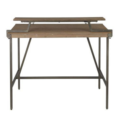 The Gia - Industrial Counter Table has a wooden top with metal legs and includes a raised, adjustable secondary shelf above the main tabletop for an elevated workspace.
