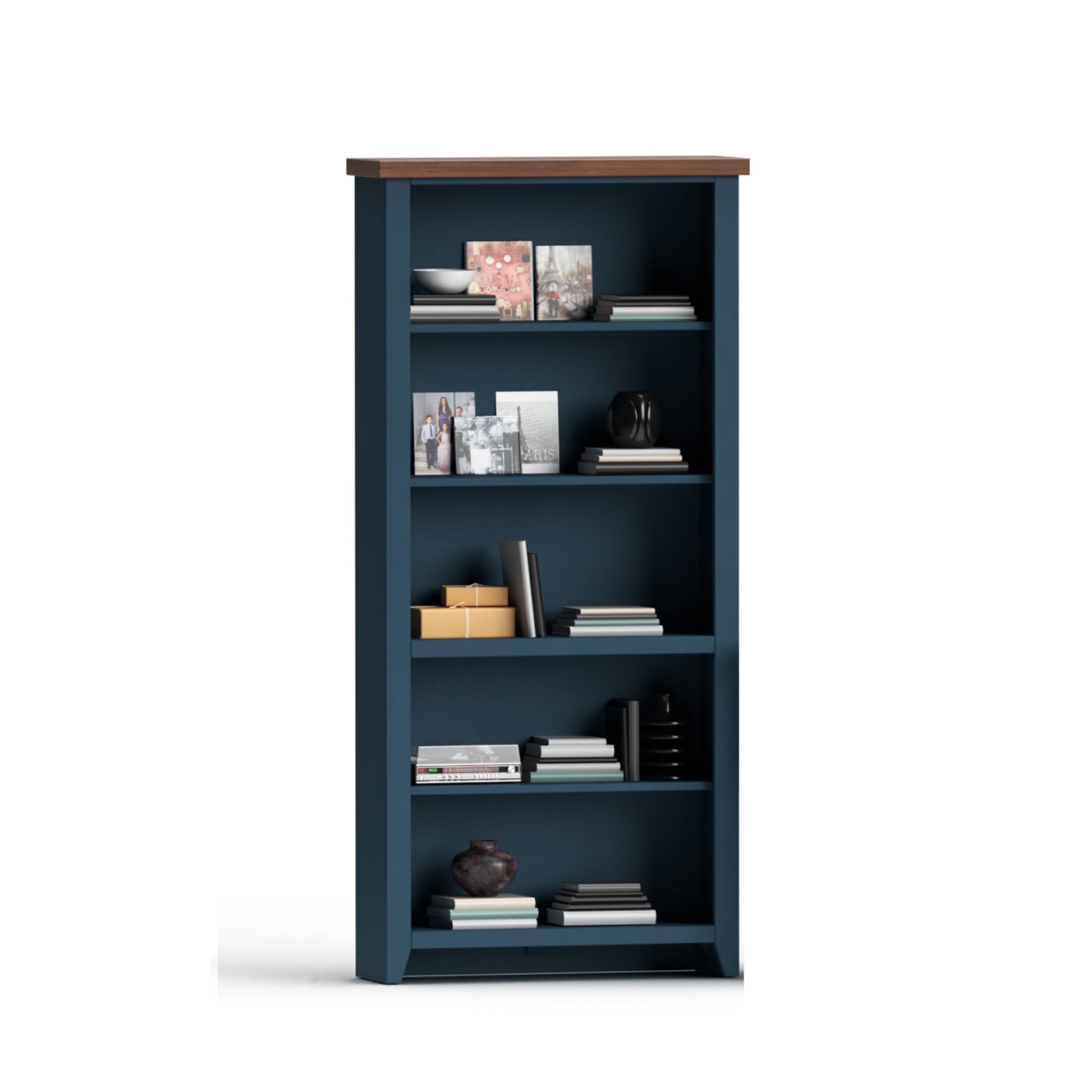 The Couch.com Nantucket 5 Shelf Bookcase in Blue Denim and Whiskey wood finish stands against a white background, its shelves arranged with books, papers, photo frames, decor items, and a ceramic vase.