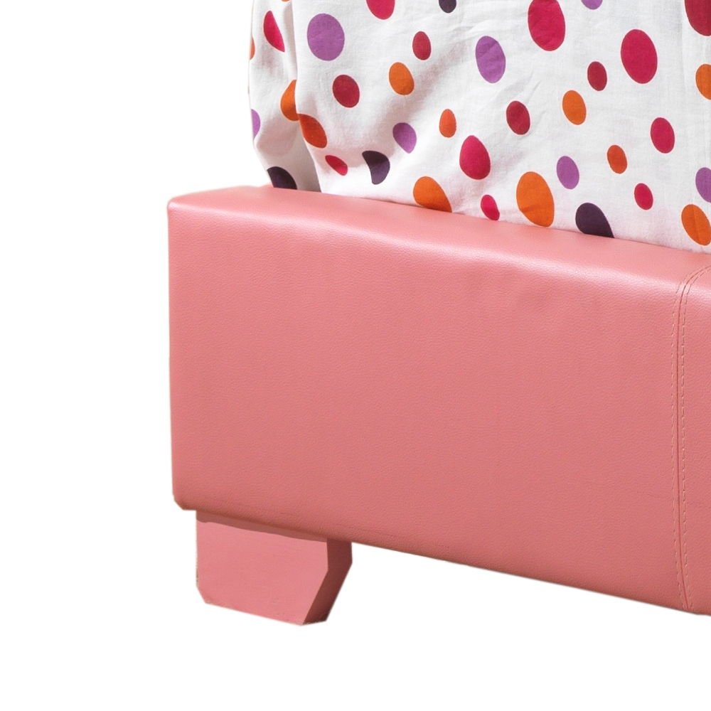 Close-up of the Elegant Platform Bed For Relaxed Spaces, featuring pink upholstery and a vibrant polka dot bedspread in red, orange, and purple draped over the corner.
