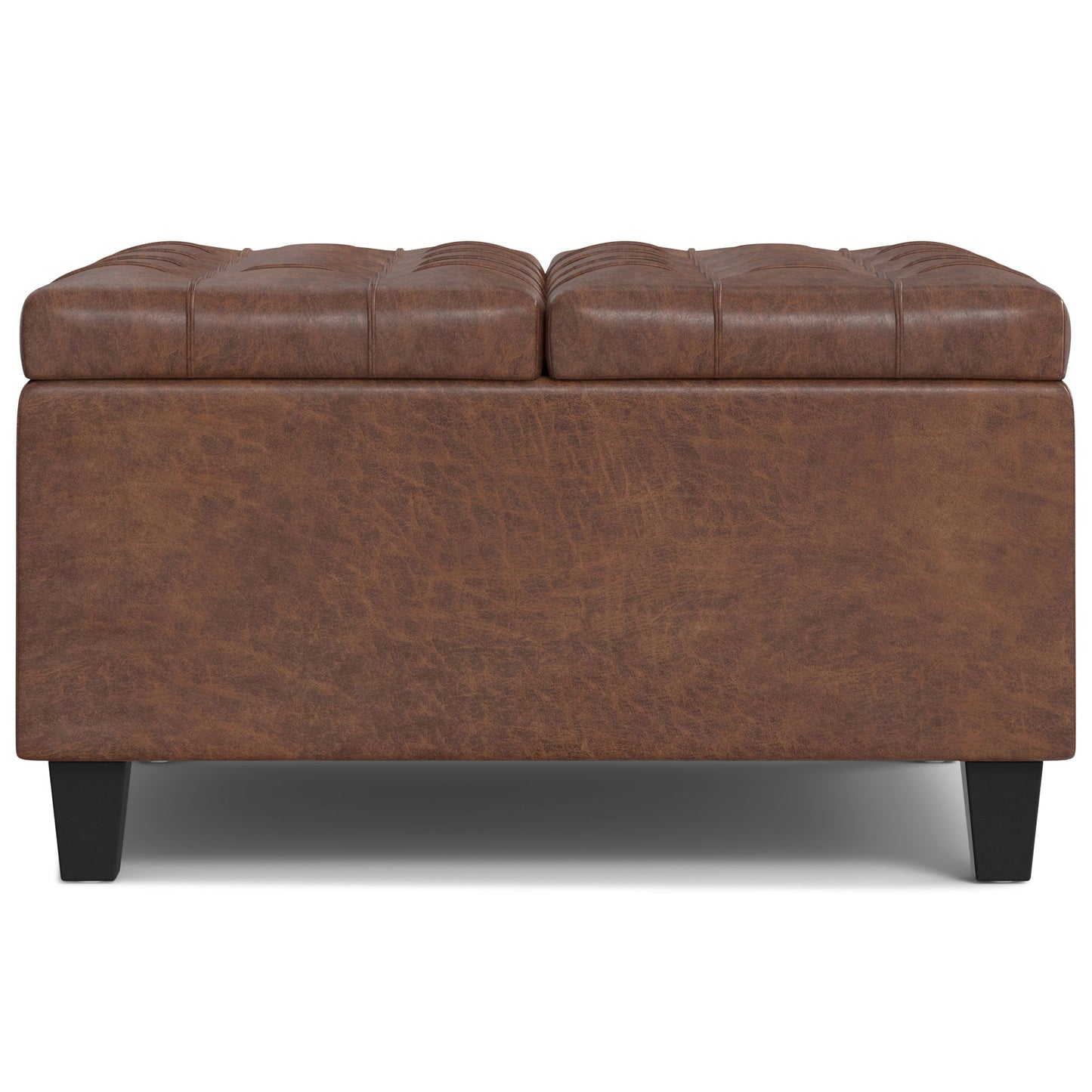 The Harrison - Large Coffee Table Storage Ottoman features brown leather, a tufted cushioned top, black legs, and a rectangular design, shown from the front on a white background.