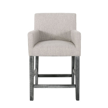 The Charmed Upholstered Counter Stool features light gray fabric, round arms, and dark H frame wooden legs, shown from the front against a white background.