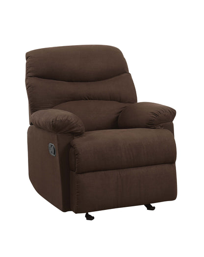 The Arcadia Micro Motion Glider Recliner is a plush, chocolate brown chair with padded armrests, a cushioned back, and a side lever for adjustable reclining. Shown against a white background.