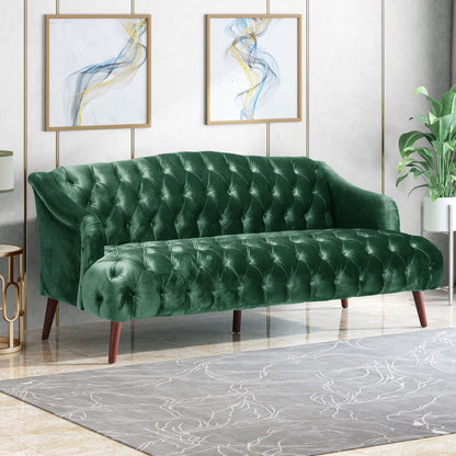 The Comfy 3 Seat Sofa With Wooden Legs, perfect for living rooms and studies, stands out in a modern space with abstract wall art, a gray patterned rug, and a leafy plant enhancing the décor.