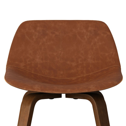 A close-up of the Randolph Bentwood Counter/Bar Height Stool (Set of 2), showcasing its brown leather seat and backrest with detailed stitching and wooden legs, set against a white background.