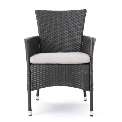Set of 2 Dimensional Outdoor Dining Chairs with black woven rattan, armrests, light gray seat cushions, and iron frames, shown from the front on a white background.
