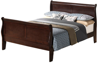A Panel Sleigh Bed with a dark wood finish, dressed in blue and gray patterned bedding, tan sheets, and two floral accent pillows.