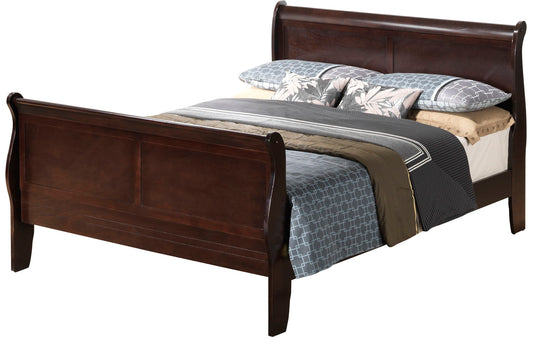 A Panel Sleigh Bed with a dark wood finish, dressed in blue and gray patterned bedding, tan sheets, and two floral accent pillows.