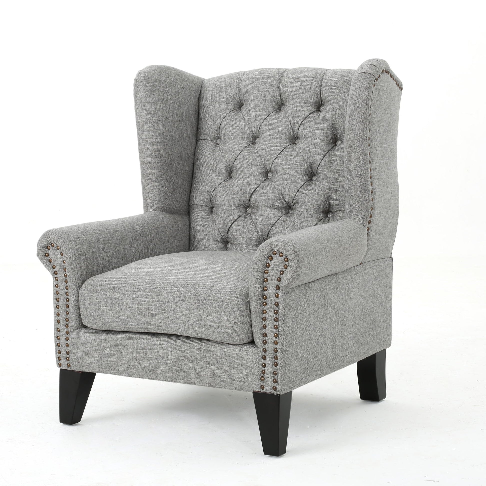 The Mid Century Modern Arm Reading Chair for Living Room features light gray upholstery, a button-tufted wingback, silver nailhead trim on the arms, and dark wooden legs, set against a plain white background.