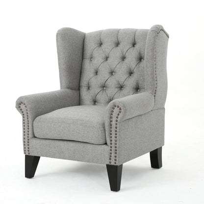 The Mid Century Modern Arm Reading Chair for Living Room features light gray upholstery, a button-tufted wingback, silver nailhead trim on the arms, and dark wooden legs, set against a plain white background.