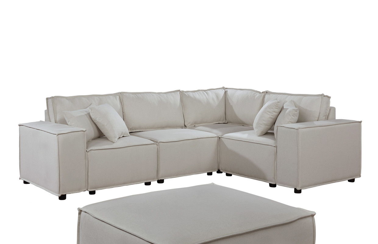 The Melrose Modular Sectional Sofa With Ottoman features a modern, light beige L-shaped design with clean lines, plush cushions, matching throw pillows, and a large square ottoman in the same fabric.