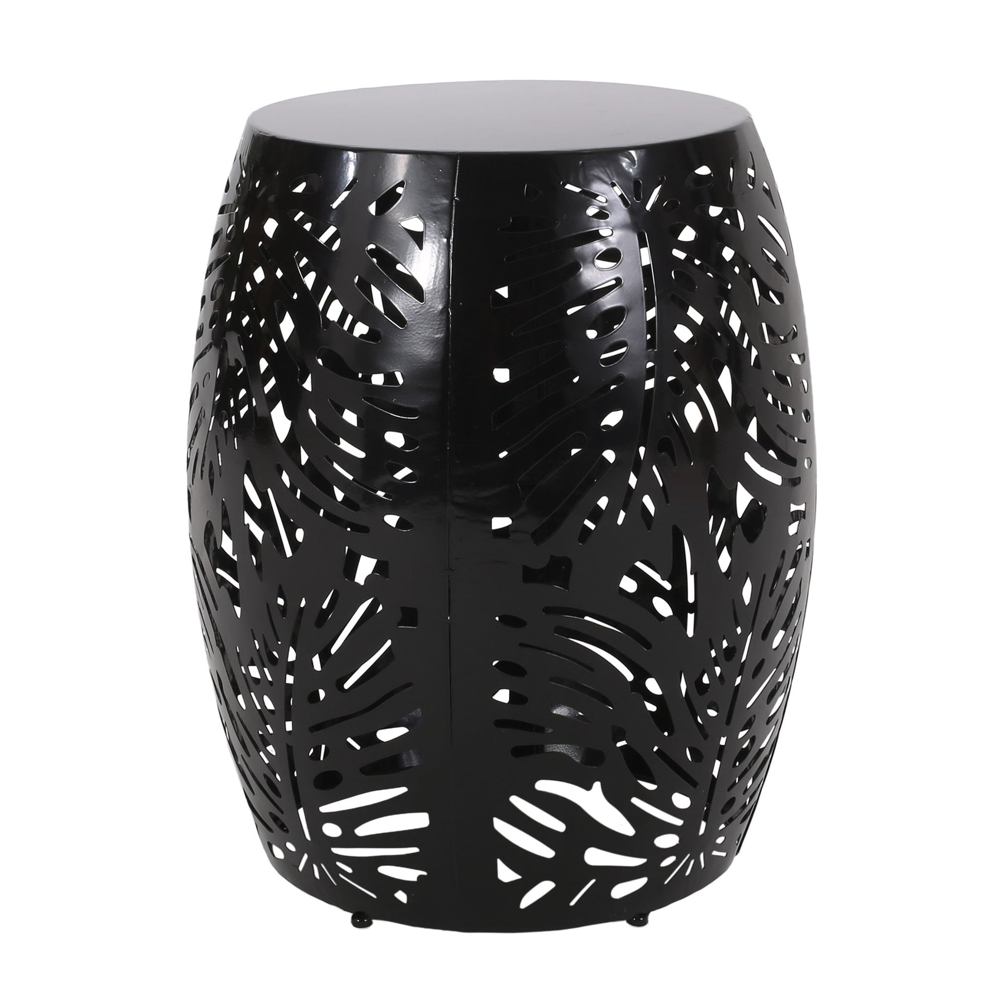 The Modern Design Metal End Table, Large, is a black drum-shaped table with perforated tropical leaf patterns in the metal, allowing light and air to flow through its stylish cutouts.