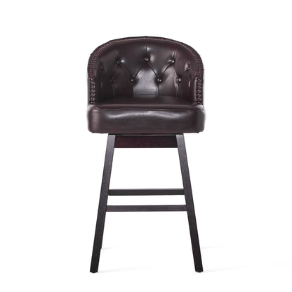 The Mellifluous 360 Degree Swivel Bar Stool, shown against a white background, features dark brown leather upholstery, a tufted rounded backrest with stunning nailhead trim, and wooden legs. Sold as a set of 2.