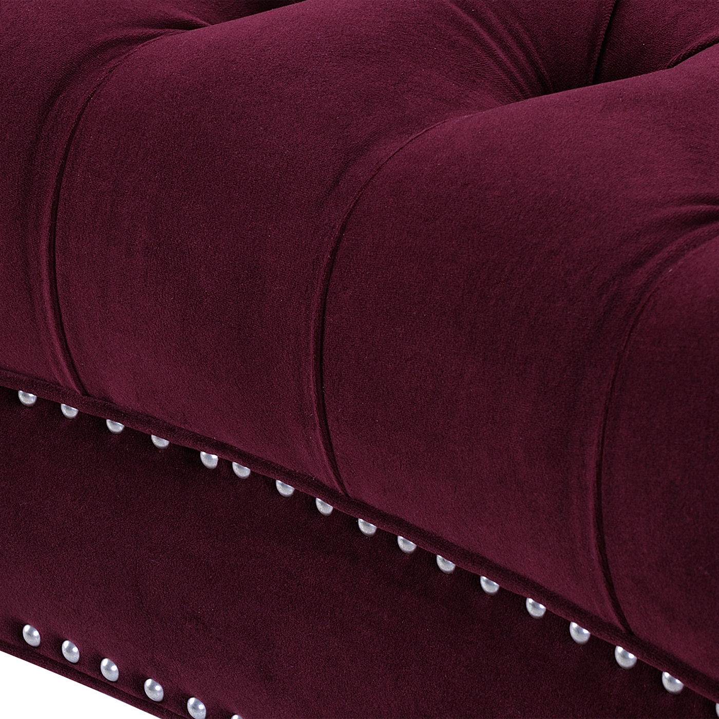 Close-up of the La Rosa - Victorian Chesterfield Loveseat with deep burgundy velvety upholstery, button tufting, and silver nailhead trim along the edge.