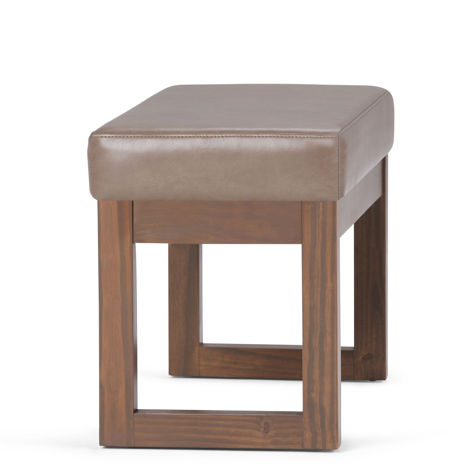 The Milltown Upholstered Ottoman Bench features a brown leather cushion and a wooden base with open square legs, displayed against a white background.