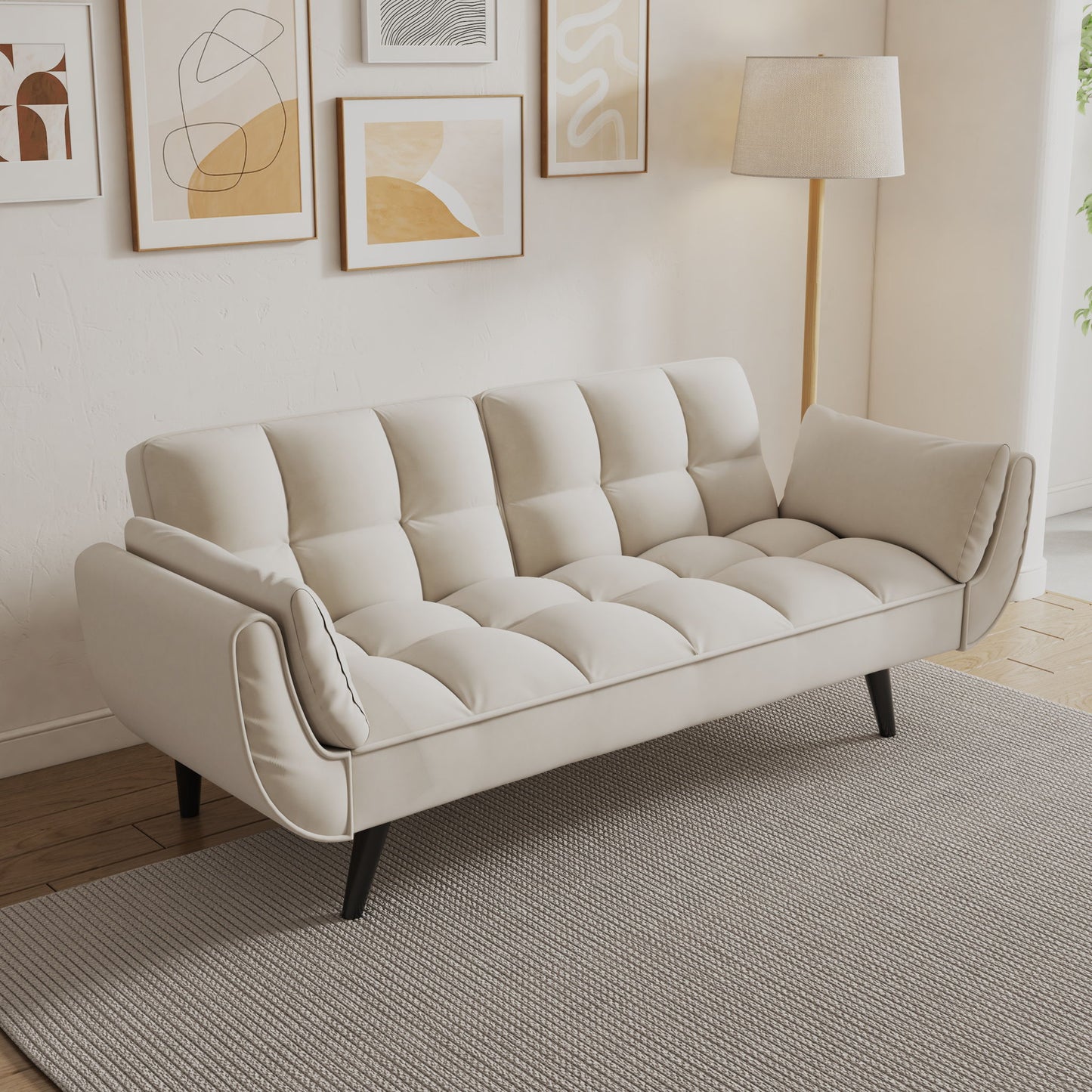 A Sofa Soft with two armrests and throw pillow sits on a light gray textured rug in a bright living room, with abstract artwork on the wall and a nearby floor lamp—perfect for apartments, bedrooms, or small spaces.