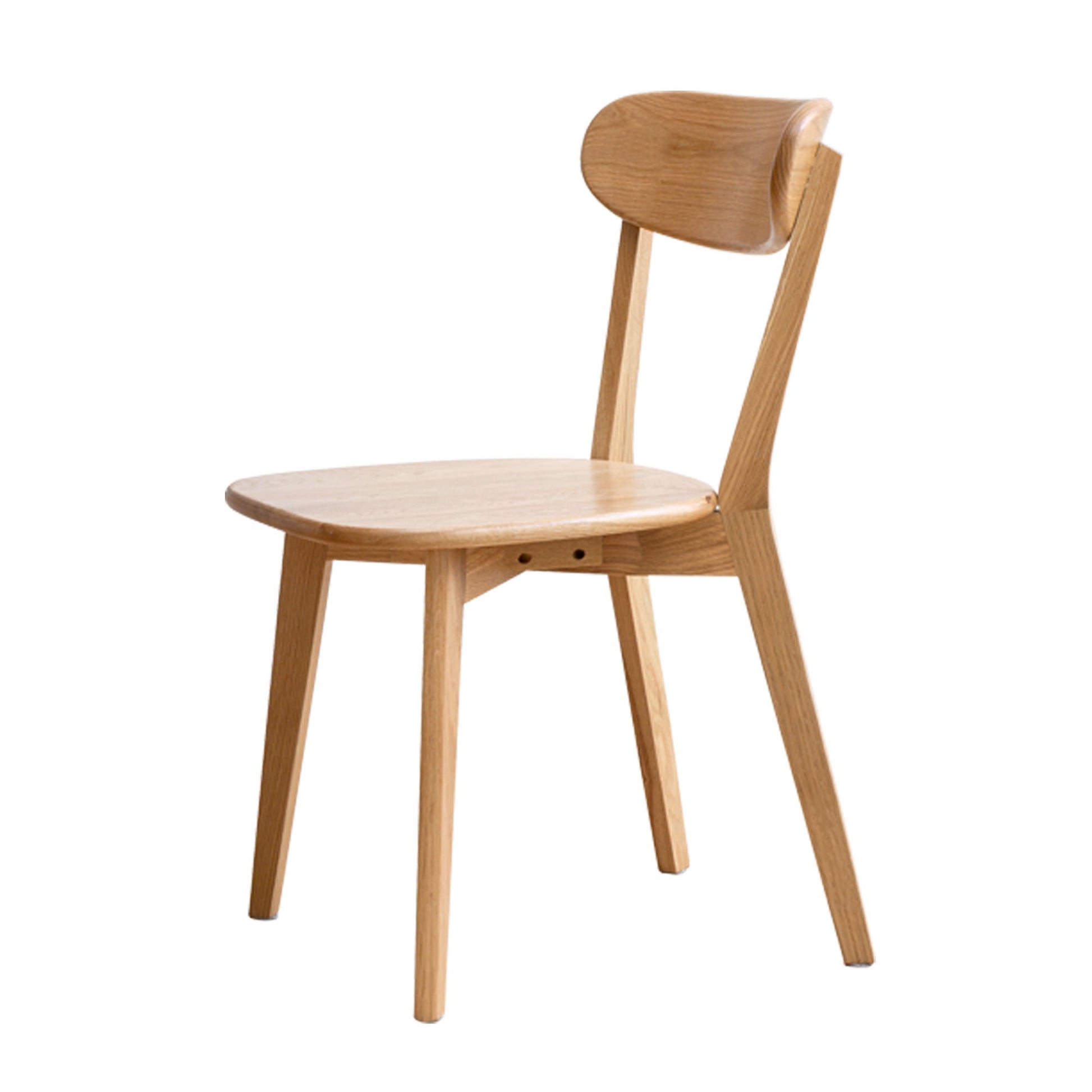 The Simple Dining Chair is a solid chair for the living room or dining area, featuring a curved backrest, angled legs, and a minimalist design in light-colored wood.