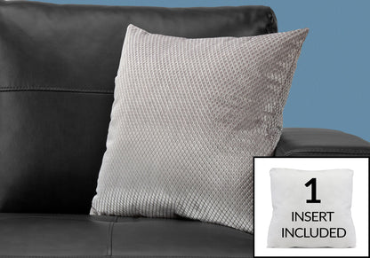 A modern light gray decorative throw pillow from Pillows rests on a black leather sofa. Inset: a white hypoallergenic square pillow insert with "1 INSERT INCLUDED" text.