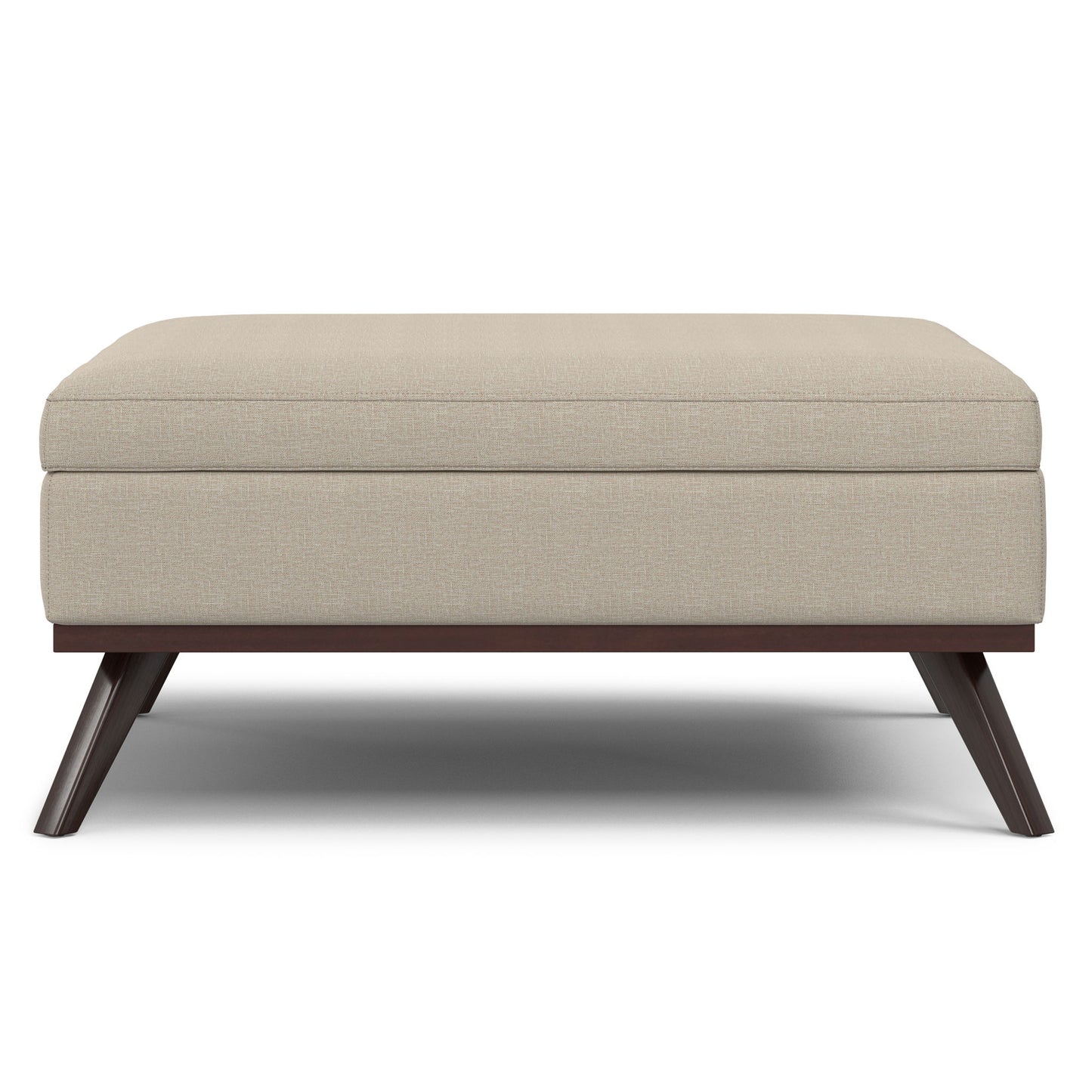 The Owen Multifunctional Square Coffee Table Storage Ottoman features beige upholstery, a cushioned top, and angled dark wooden legs, all presented against a white background.