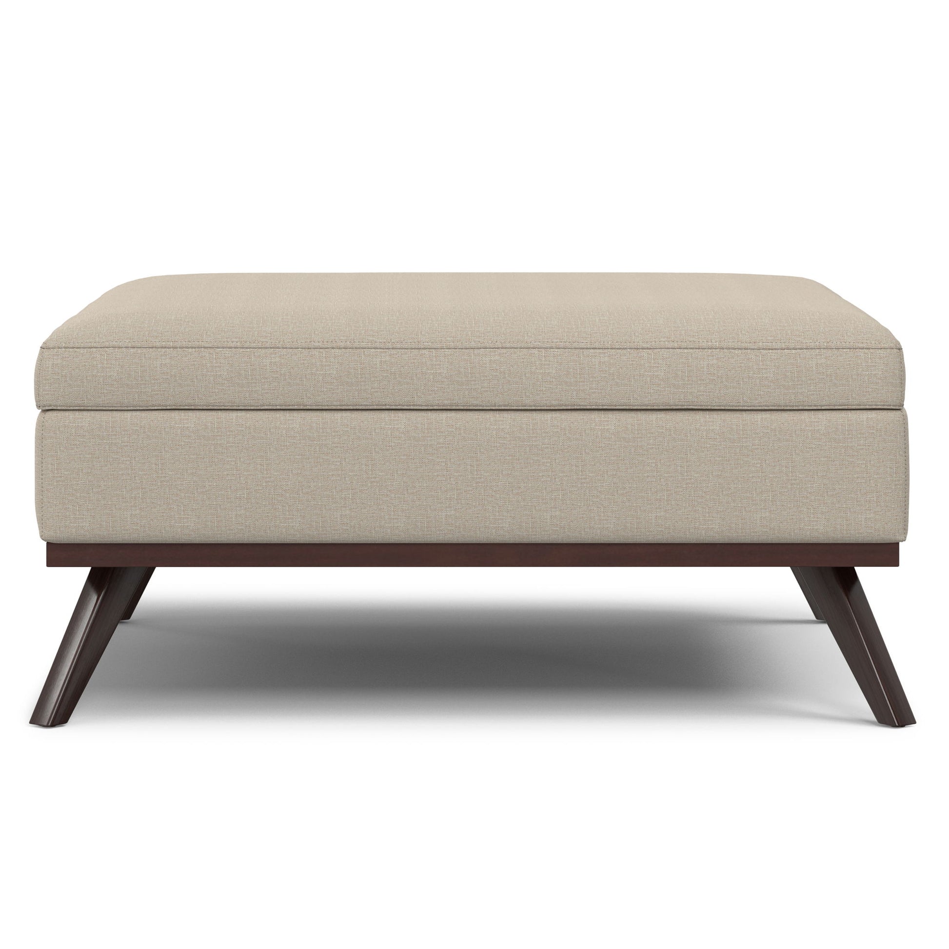 The Owen Multifunctional Square Coffee Table Storage Ottoman features beige upholstery, a cushioned top, and angled dark wooden legs, all presented against a white background.