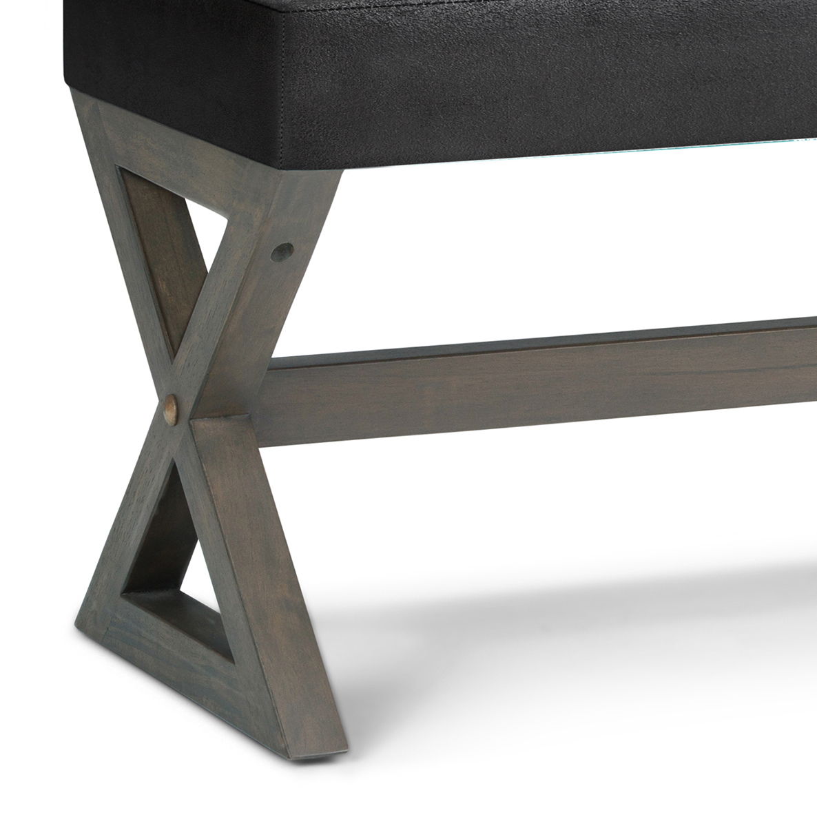 Close-up of the Salinger - Large Upholstered Ottoman Bench, featuring a dark upholstered seat and a rustic X-shaped wooden base with clean lines.