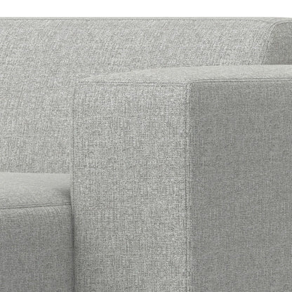 Close-up of the corner and armrest of the Rex - Right Chaise Sofa Module in gray, featuring a modern boxy design with textured upholstery.