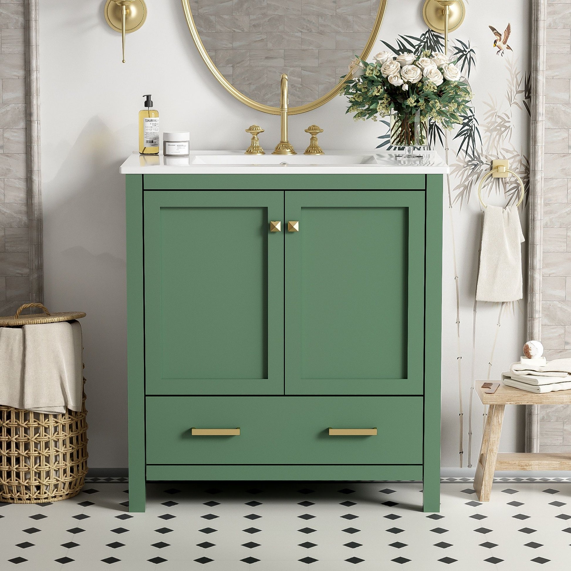 A Bathroom Vanity With Single Sink, combo cabinet, 2 doors, and a drawer with soft-closing is topped with a white countertop and gold handles. It sits in front of a round mirror on black-and-white tile flooring, with accessories placed on top.