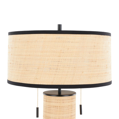 The Cylinder - Rattan Contemporary Rattan Table Lamp features a cylindrical beige woven rattan shade with black trim on the top and bottom edges and two pull chains.