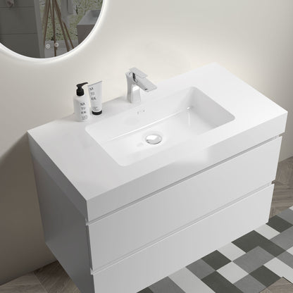 The Alice Bathroom Vanity is a modern, wall-mounted, floating vanity with a one-piece rectangular sink basin (no drain or faucet included), featuring clean lines and large storage. It’s shown on a geometric tiled floor with two soap bottles on the left.