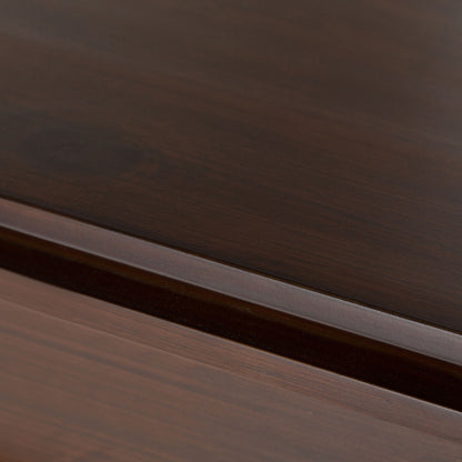 Close-up of the Artisan - Handcrafted Sideboard Buffet, showcasing polished dark brown wood surfaces with visible grain and a subtle groove separating two panels.