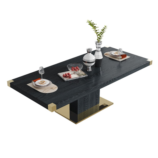 The Top Dining Table With Finish Corner is a modern rectangular black table with gold accents, set for two with plates, glasses, pastries, fruit, and decorative silver and white vases with green leaves on a white background.