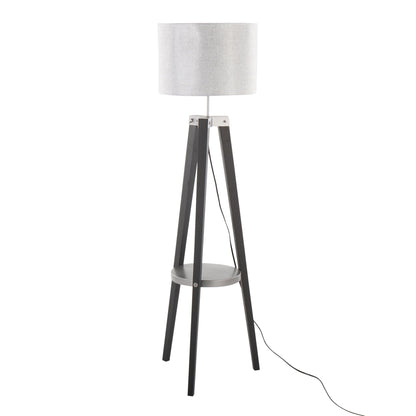 The Compass Mid Century Modern Floor Lamp features a cylindrical white shade, three black wooden tripod legs, a small circular shelf between the legs, and a visible black power cord.