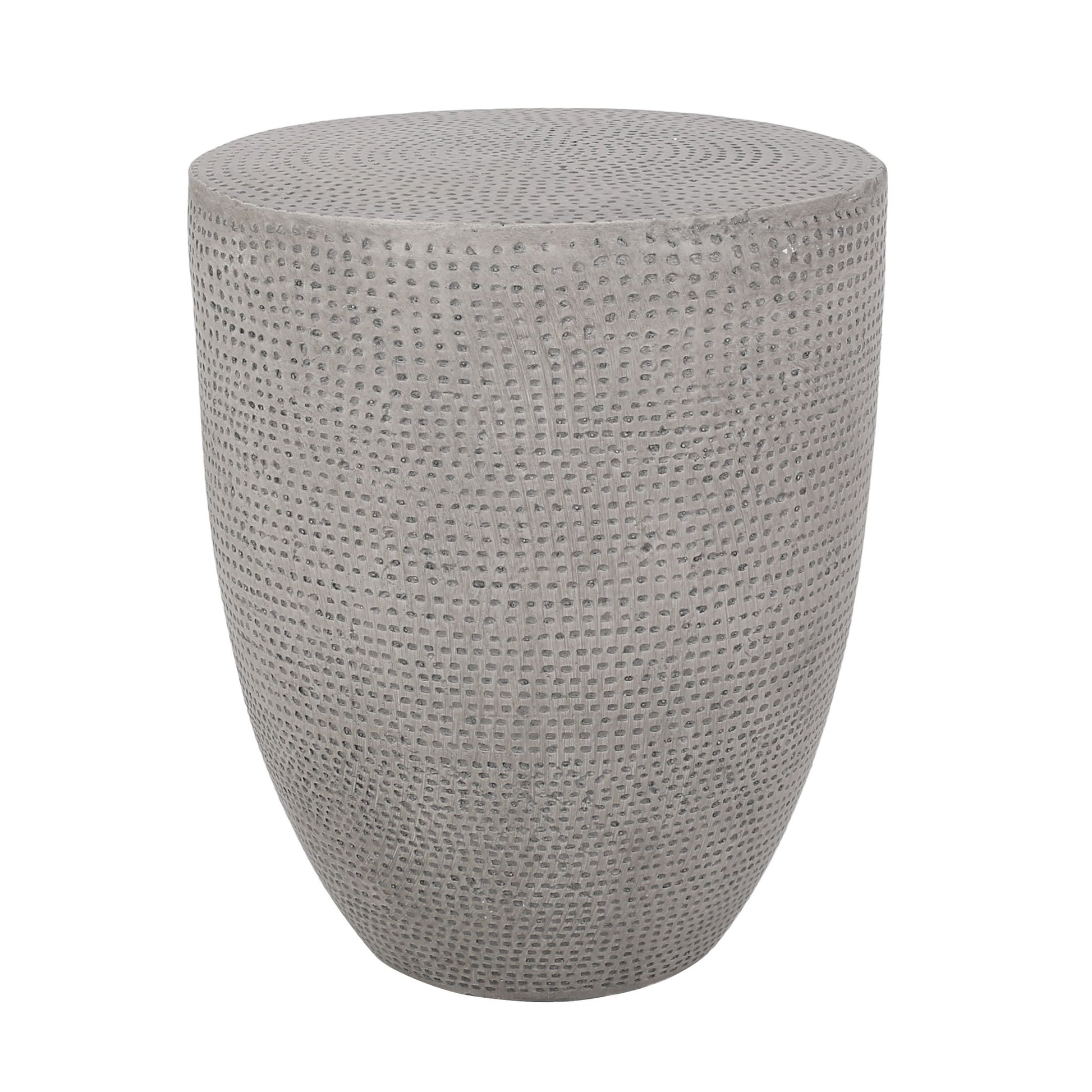 The Outdoor Lightweight Concrete Side Table in Natural features a round, gray design with a textured, dotted surface and smooth, curved silhouette, shown against a white background.