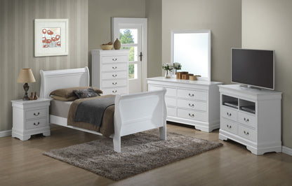 A modern bedroom features the Panel Sleigh Bed with white furniture, including a nightstand, dresser with mirror, TV stand, and beige rug on wooden flooring. A lamp, framed art, decor items, and sunlight from a window complete the scene.