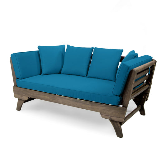 The Ottavio Convertible Sofa Daybed features a modern wooden frame with angled legs and water-resistant bright blue seat and back cushions.