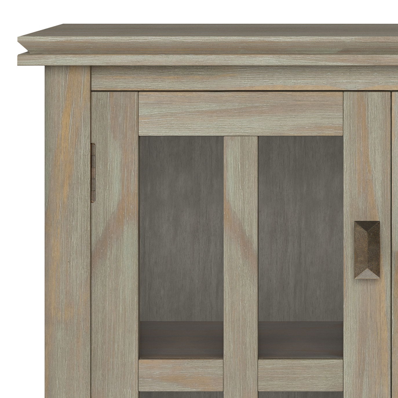 Close-up of the upper left corner of the Artisan - Handcrafted Low Storage Cabinet, showcasing its weathered gray finish, glass panel doors with vertical wooden frames, and a rectangular metal handle on the right door.