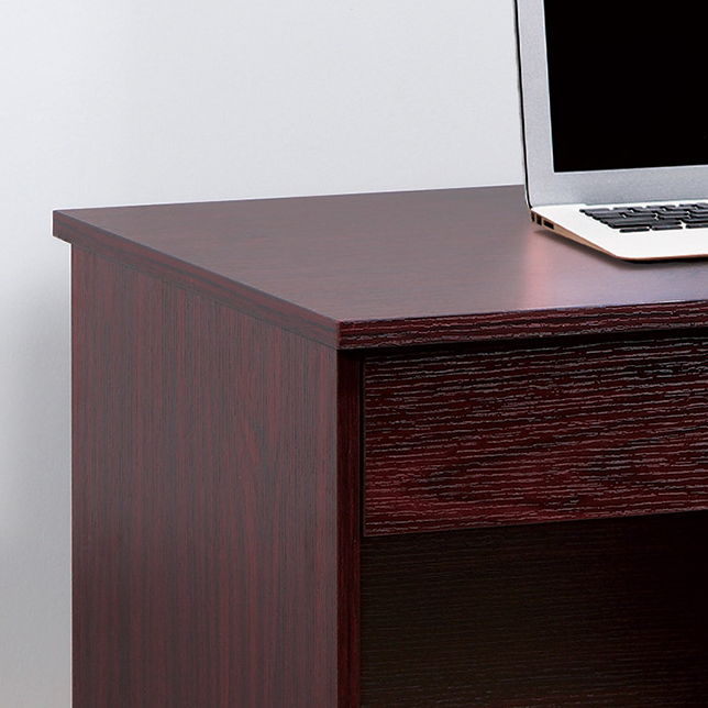 A partial view of the Mahogany Three Locking Drawers Student Desk with metal bar handles and a modesty panel, showing a drawer and the corner of an open laptop on top.