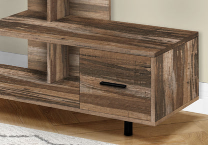 A close-up of the contemporary TV Stand, Console, and Media Entertainment Center with a rustic finish, open shelf, storage drawer with a black handle. It sits on a wooden floor beside a light-colored wall and part of a rug.