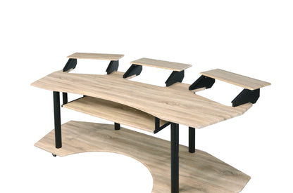 The Eleazar Music Recording Studio Desk features a modern wood design with black metal legs, an upper monitor tier, spacious work surface, lower shelf, and a front curved cut-out—ideal for music production setups.