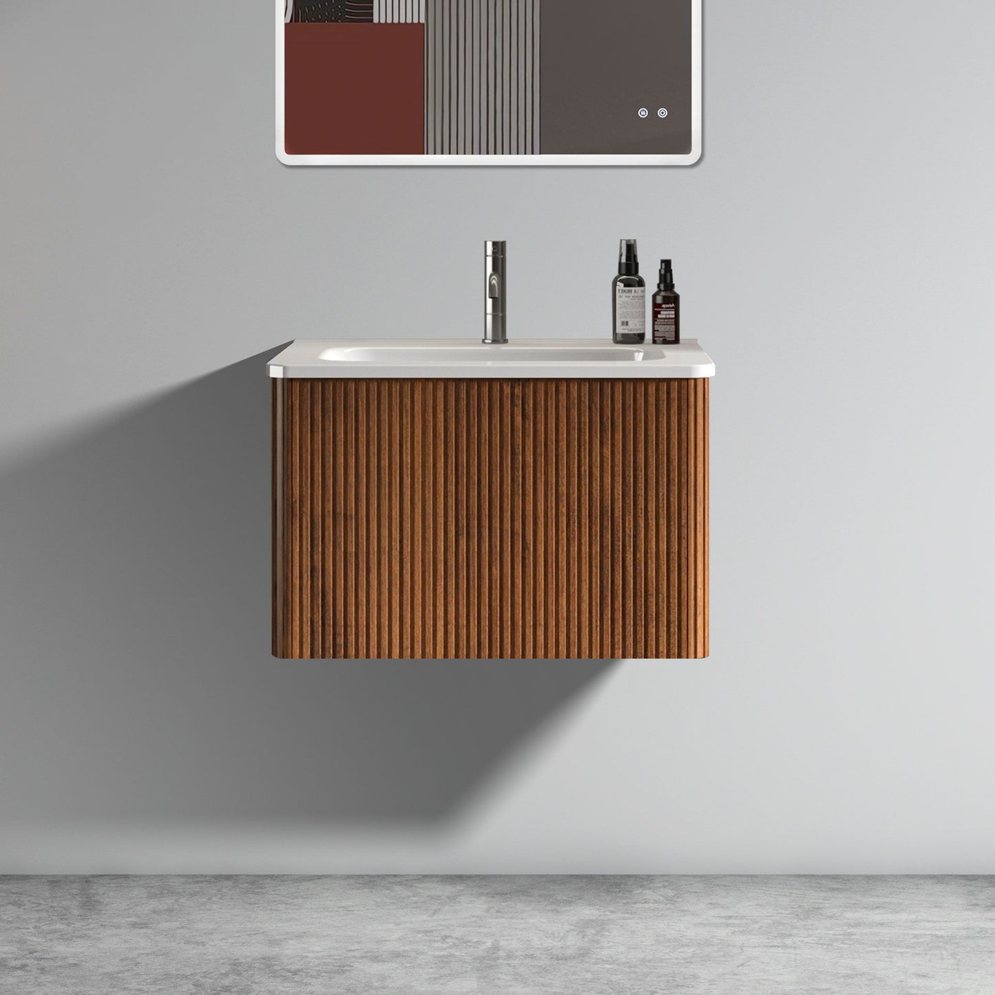 The Etna Striped Bathroom Vanity features vertical wood panels, a ceramic sink, and wall-mounted floating design. A white countertop holds toiletry bottles, and a minimalist mirror hangs above on the light gray wall.
